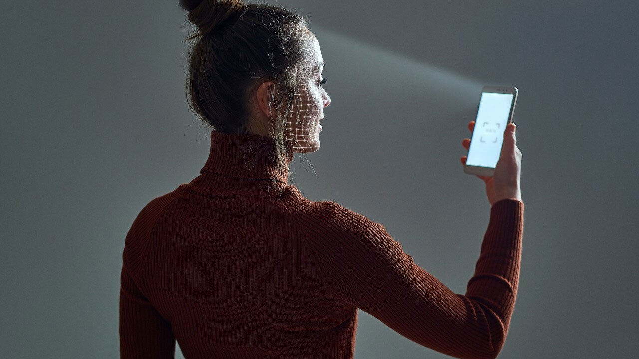 A woman using Face ID technology
