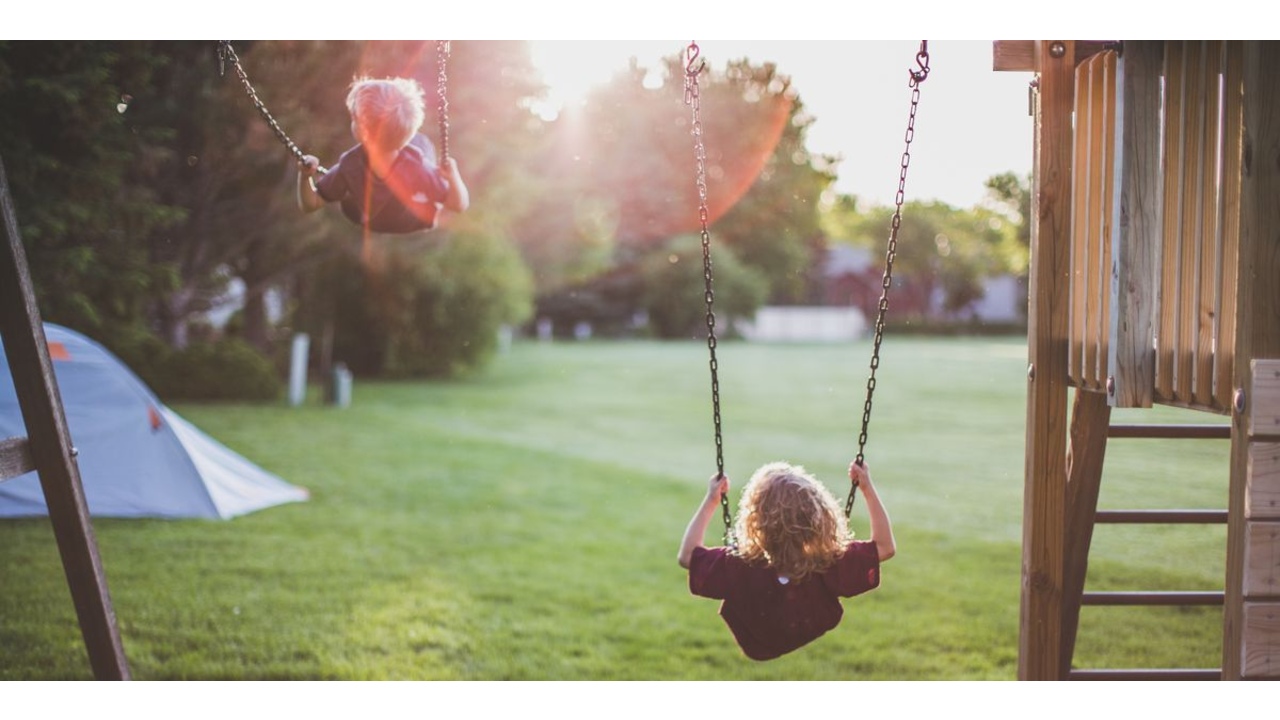 Children swinging on a swing