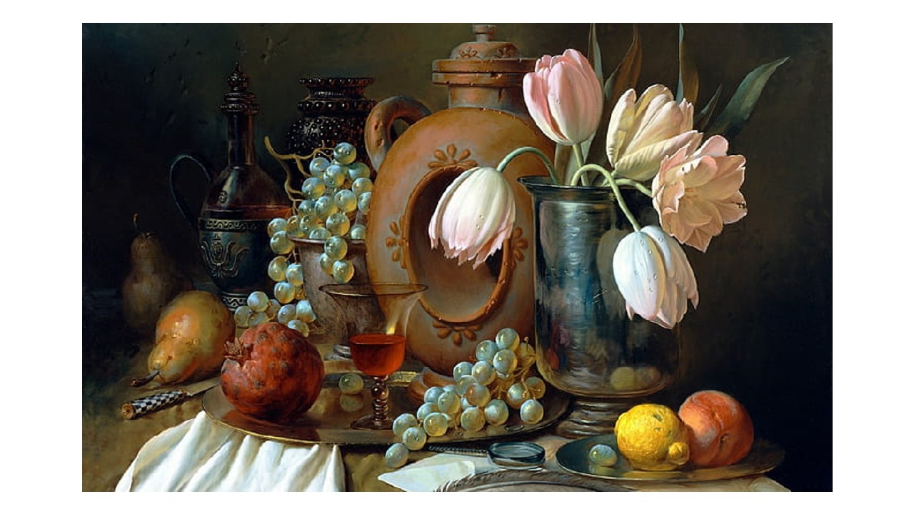 a table with flowers and fruits