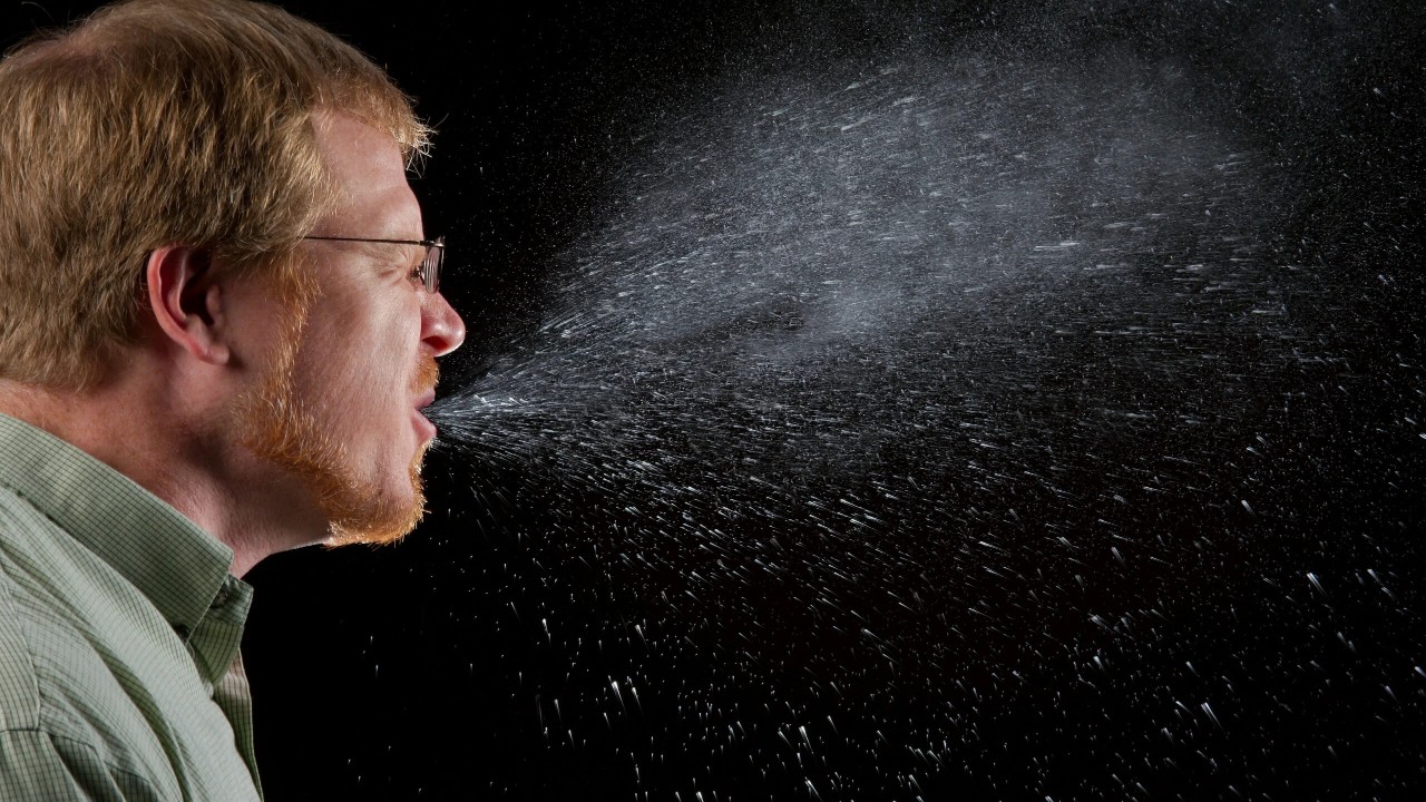sneezing man