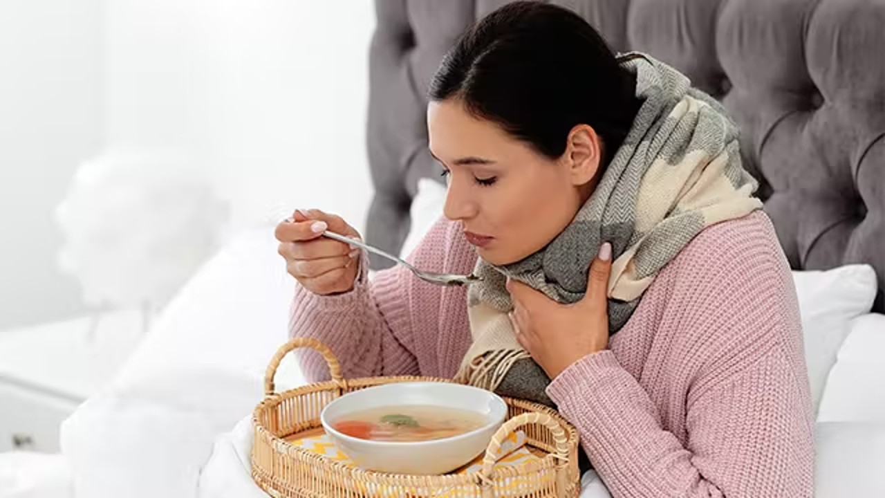 person drinking soup