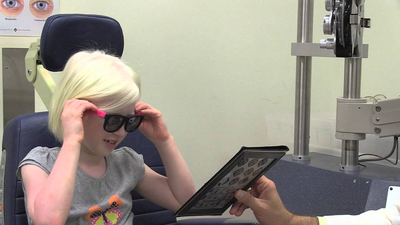 A child with albinism receiving treatment