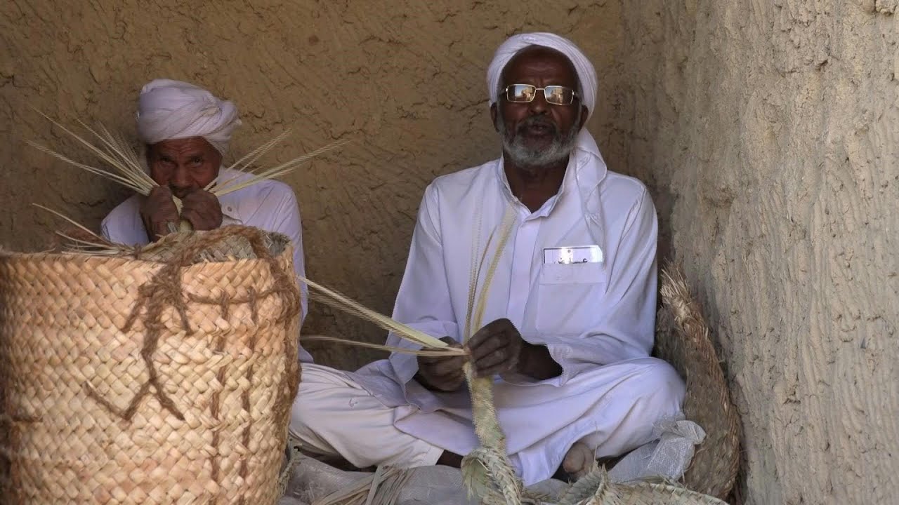Berbers wearing the traditional white dress of Siwa