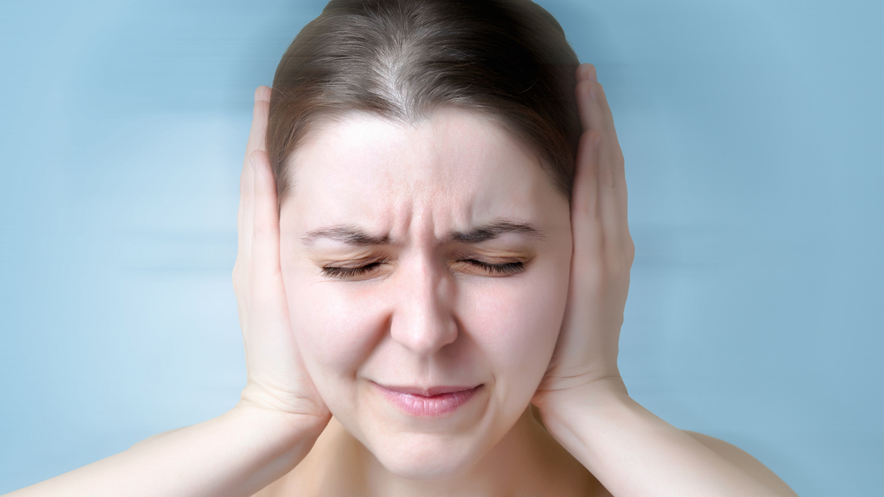 What does tinnitus indicate?